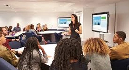 Trainer leading a classroom session with participants